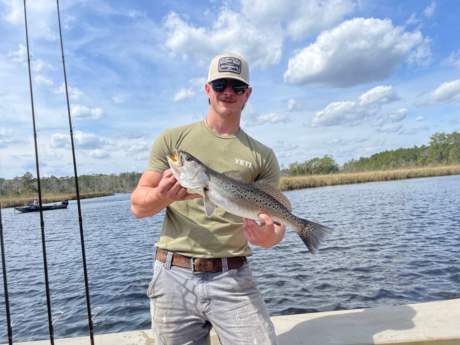 Angler holding a speckled trout