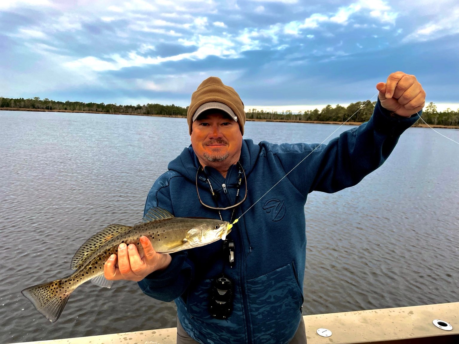 Angler holding a coastal fish