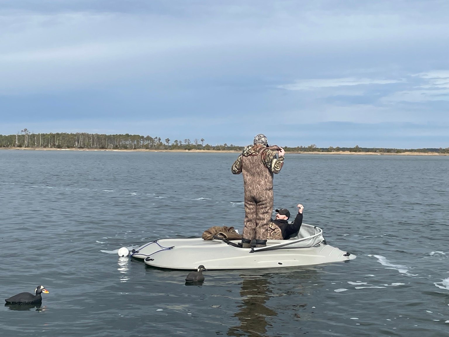 Duck hunters on the water